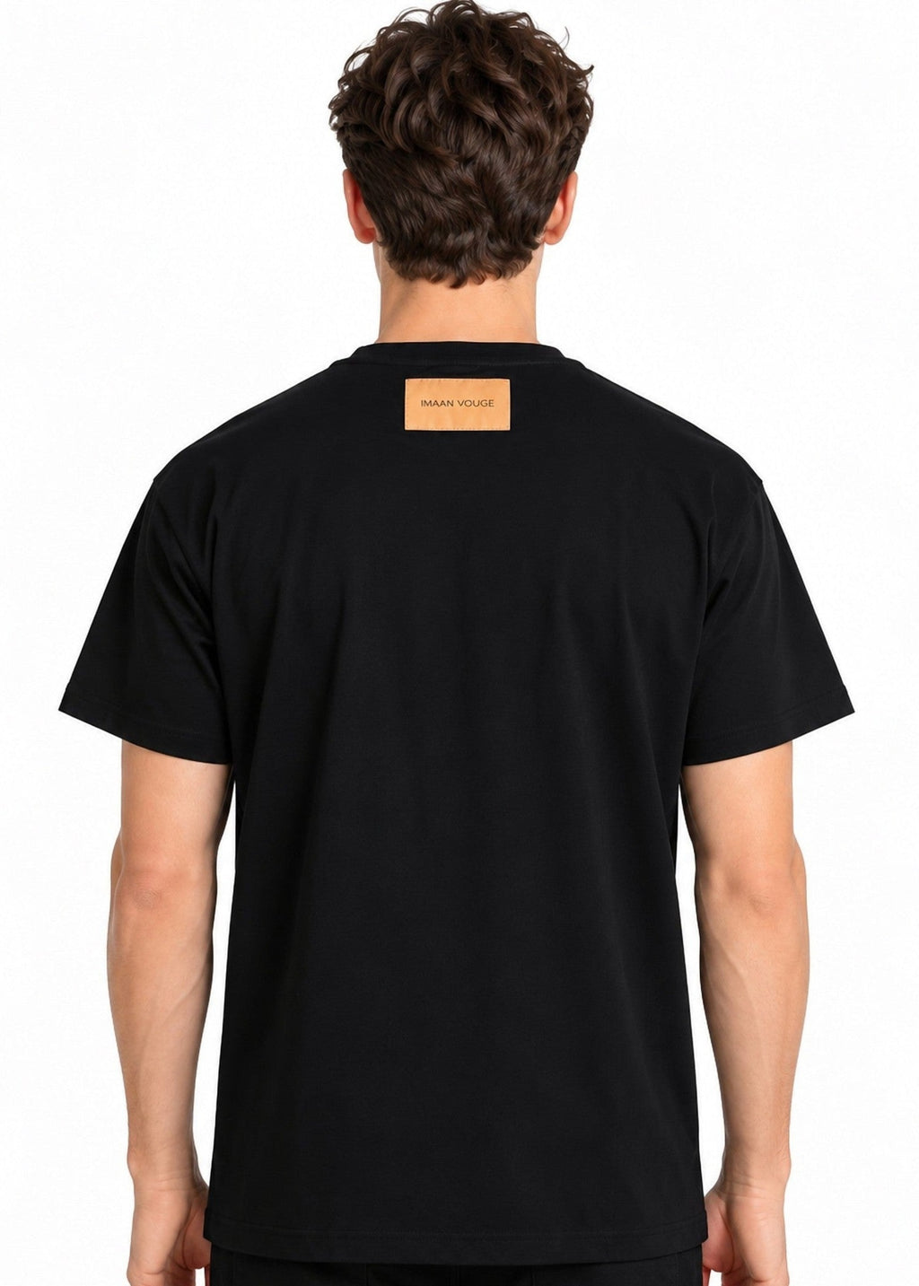 Model wearing the Imaan Vouge Adorned T-Shirt in black, back view showing the signature logo patch