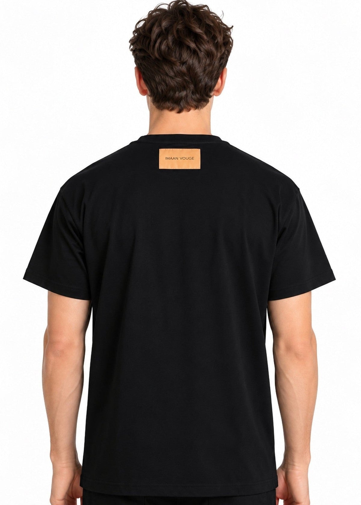 Model wearing the Imaan Vouge Adorned T-Shirt in black, back view showing the signature logo patch