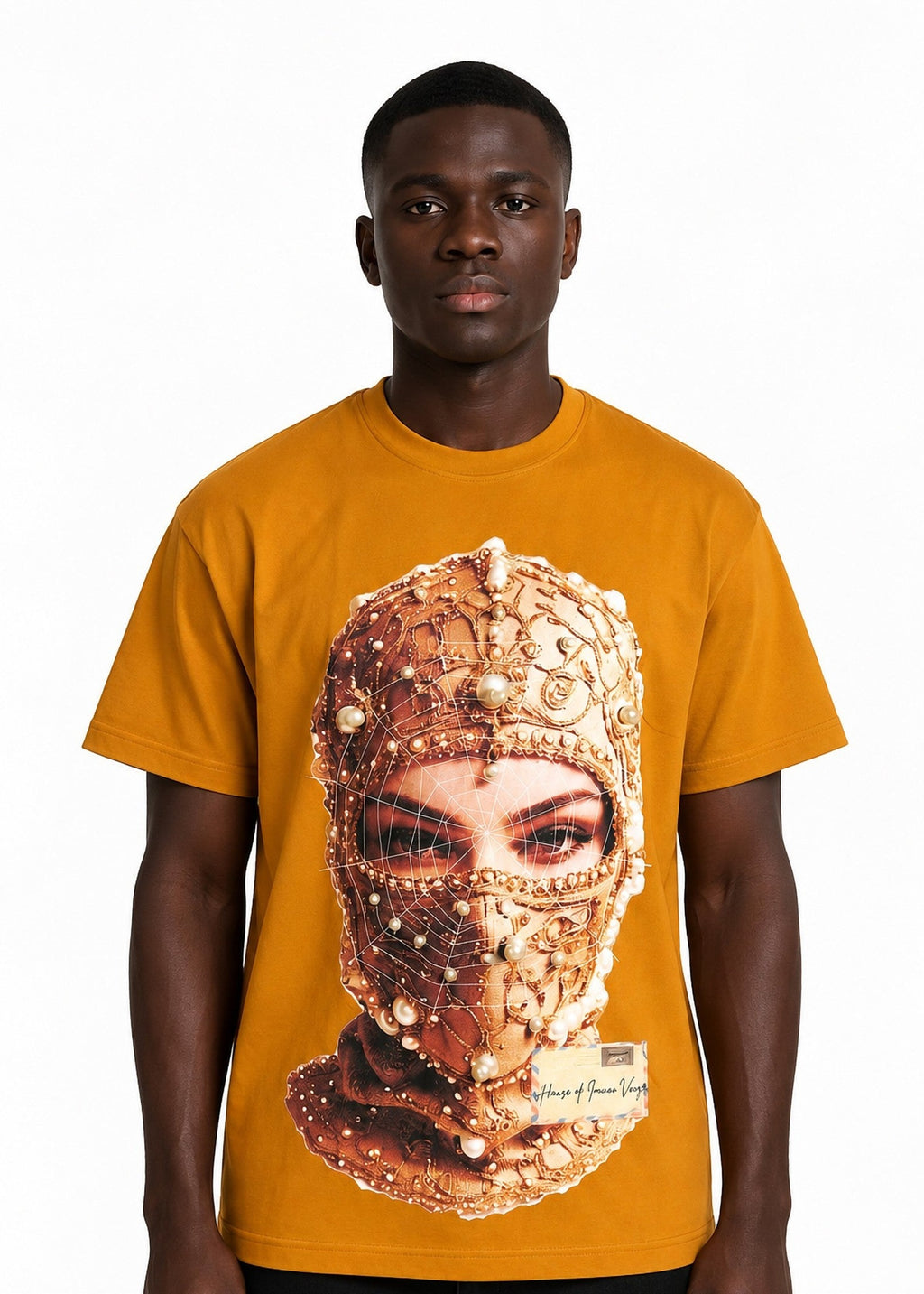 Model wearing the Imaan Vouge Adorned T-Shirt in coffee brown with hand-set pearl graphic, front view